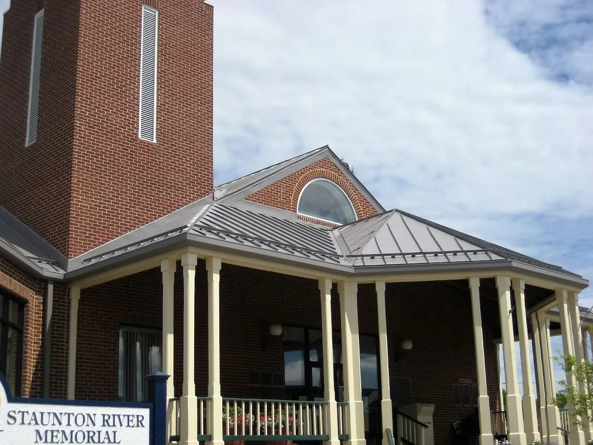 Skilled roofing craftsmen working on a residential roof in Defuniak Springs